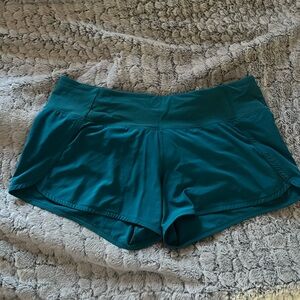 Teal/turquoise running shorts - zipper pocket in back - lined